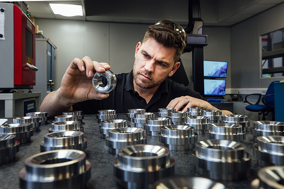 Engineer inspecting precision components