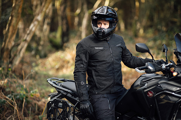 Motorcycle, adventure rider in the wilderness on a new Africa Twin