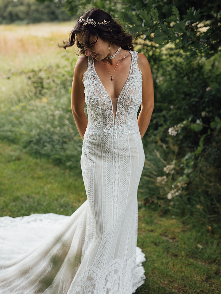 A lace wedding dress captured informally during a Pembrokeshire Wedding