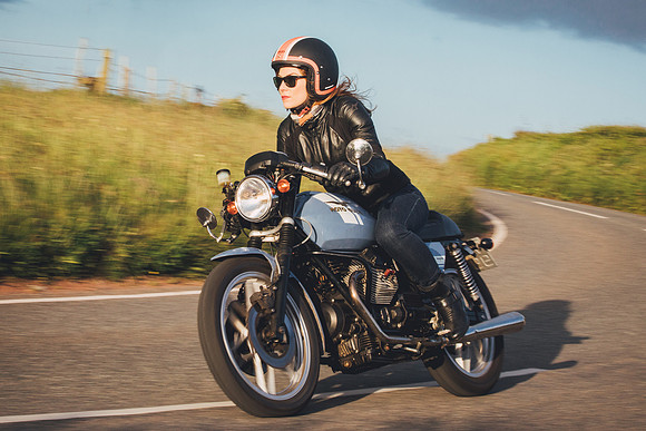 Moto Guzzi V50 Cafe Racer ridden by female rider