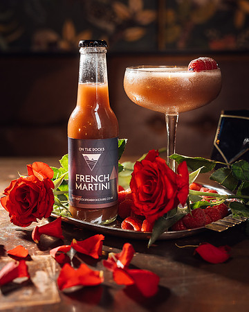 On The Rocks French Martini cocktail in a glass with roses