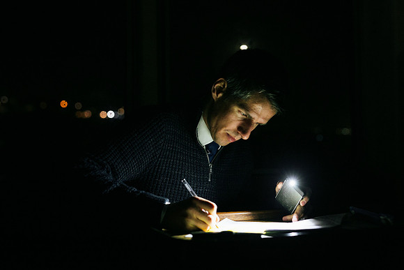 Taking notes at night on a pilot boat