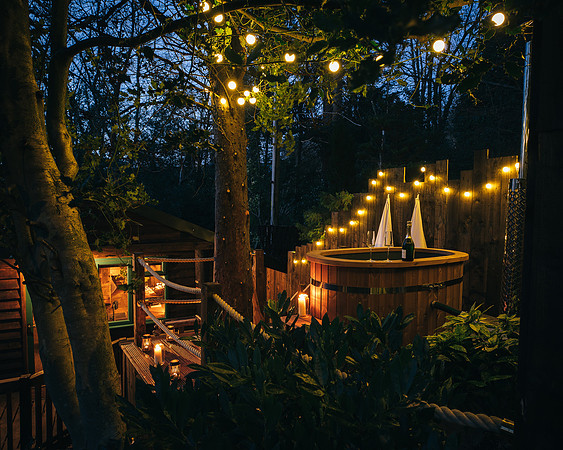 Beautifully illuminated hot tub with festoon lights