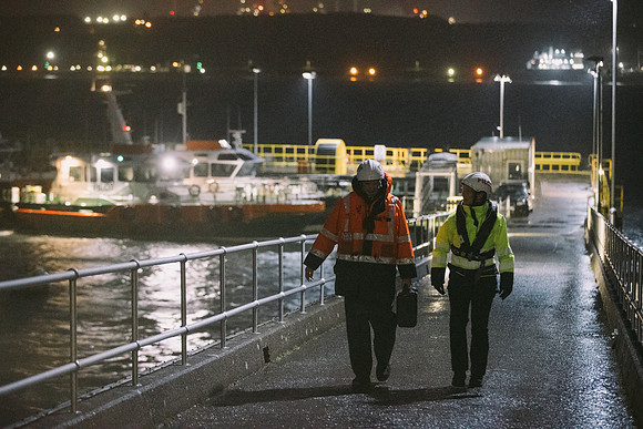 Crew members of the pilot board leaving work