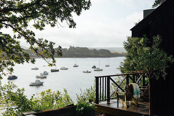 The balcony overlooking the water at the Boathouse in Devon