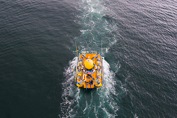 The Wave Sub wave energy device photographed by drone as it is towed out for testing