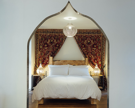 Unique archway looking towards the bed