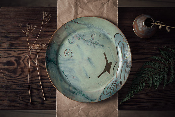 Studio lit image of a place handmade by Mena Cermaics