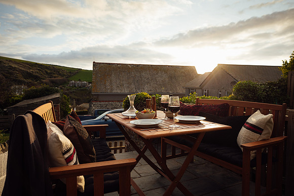 Sunset dinner laid out with wine at Beacon Cottage, Cornwall